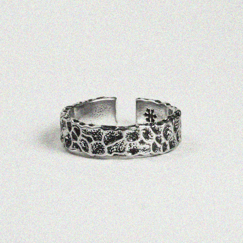1. A silver ring featuring a delicate flower design, showcasing elegance and charm in its intricate details.

2. A beautiful silver ring adorned with a floral pattern, perfect for adding a touch of nature-inspired style.

3. A stylish silver ring with a lovely flower design, combining simplicity and beauty in one elegant piece.

