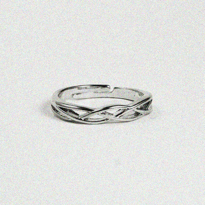 A sleek silver ring featuring a stylish curved design, perfect for adding a touch of elegance to any outfit.