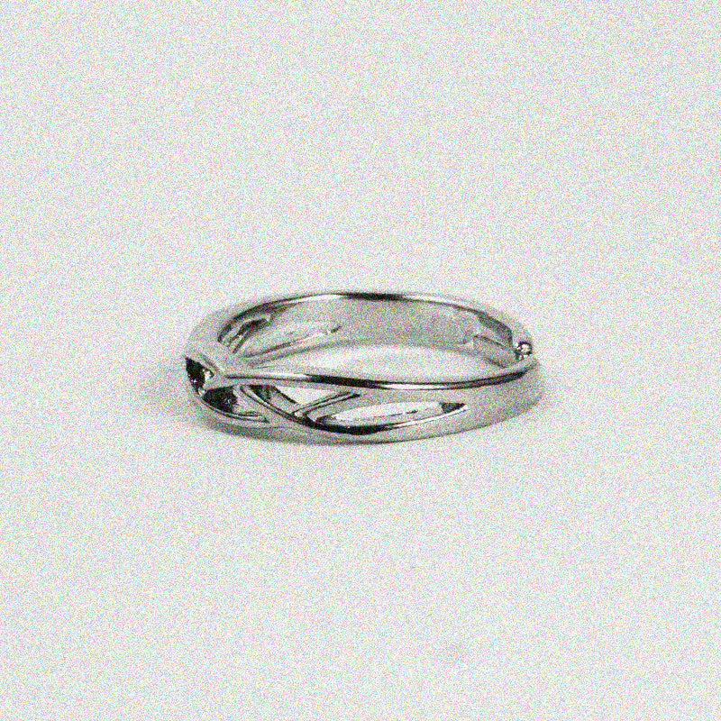 1. A sleek silver ring featuring a stylish curved design, perfect for adding a touch of elegance to any outfit.

2. A modern silver ring showcasing a unique curved design, ideal for those who love minimalist jewelry.

3. A chic silver ring with a smooth, curved design, making it a standout accessory for any jewelry collection.